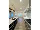 Bright, open kitchen with island seating, high-end appliances, and views into adjacent living spaces at 8827 Wingard Rd, Waxhaw, NC 28173