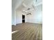The living room boasts detailed trim, hardwood floors, a modern light fixture, and ample natural light at 8827 Wingard Rd, Waxhaw, NC 28173