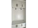 Mudroom with built-in bench seating, lockers, and cabinets at 8827 Wingard Rd, Waxhaw, NC 28173