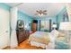 Bright bedroom with hardwood floors and a ceiling fan at 912 Mcalway Rd # D, Charlotte, NC 28211