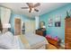 Bedroom featuring hardwood floors, teal walls, ceiling fan and a walk-in closet at 912 Mcalway Rd # D, Charlotte, NC 28211