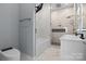 Modern bathroom with tub, glass shower, double vanity, and marble tile at 913 Wilson W Lee Blvd, Statesville, NC 28677
