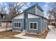 Angle view of a blue home with a modern roof and a well-maintained lawn at 913 Wilson W Lee Blvd, Statesville, NC 28677