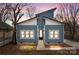Charming blue home boasting a modern design and a welcoming entrance with black trim windows, enhancing curb appeal at 913 Wilson W Lee Blvd, Statesville, NC 28677