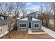 Street view of a modern home with blue siding, striking roofline, and a walkway at 913 Wilson W Lee Blvd, Statesville, NC 28677