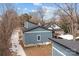 Aerial shot of a modern blue house with backyard, AC unit and new roof at 913 Wilson W Lee Blvd, Statesville, NC 28677