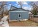 Rear view of a blue home, showcasing the siding, window, and AC unit at 913 Wilson W Lee Blvd, Statesville, NC 28677