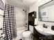 Bathroom featuring a checkered shower curtain, a tub, and a single vanity at 101 Loya St, Mount Holly, NC 28120