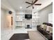Spacious living room with built-in shelving, a modern fireplace, and beautiful marble floors at 101 Loya St, Mount Holly, NC 28120