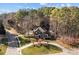 Aerial view showcasing the beautiful home surrounded by mature trees and lush landscaping at 102 Wyndham Way, Salisbury, NC 28147