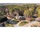 Breathtaking aerial view showcasing the home nestled among lush greenery and mature trees on a sprawling lot at 102 Wyndham Way, Salisbury, NC 28147