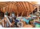 An attic full of storage with exposed wooden beams at 102 Wyndham Way, Salisbury, NC 28147