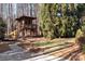 A backyard featuring a treehouse at 102 Wyndham Way, Salisbury, NC 28147