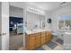 Bright bathroom with double sinks, a large mirror, and a view to a bedroom with a matching design at 102 Wyndham Way, Salisbury, NC 28147