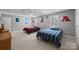 Bright bedroom featuring two beds, neutral paint, carpet and natural light from two windows at 102 Wyndham Way, Salisbury, NC 28147