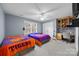 Neutral bedroom featuring two beds, a built-in desk, carpet, and a window for natural light at 102 Wyndham Way, Salisbury, NC 28147