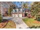 Stately brick home with a three-car garage and a spacious driveway and lawn at 102 Wyndham Way, Salisbury, NC 28147