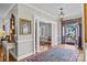 Elegant foyer with hardwood floors, decorative rug and chandelier creates a grand and welcoming entrance at 102 Wyndham Way, Salisbury, NC 28147