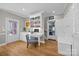 Bright home office with built-in desk, shelving, and hardwood floors at 102 Wyndham Way, Salisbury, NC 28147