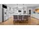 Modern kitchen with a large island, stainless steel appliances, and white cabinets at 102 Wyndham Way, Salisbury, NC 28147
