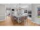 Open-concept kitchen featuring an island with seating, stainless steel appliances, and hardwood floors at 102 Wyndham Way, Salisbury, NC 28147