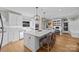 Bright kitchen with a large island, stainless steel appliances, and an adjacent workspace at 102 Wyndham Way, Salisbury, NC 28147