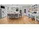 Open-concept kitchen featuring an island with seating, stainless steel appliances, and hardwood floors at 102 Wyndham Way, Salisbury, NC 28147
