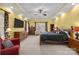 Spacious main bedroom featuring a tray ceiling, neutral carpet, warm paint and recessed lighting at 102 Wyndham Way, Salisbury, NC 28147