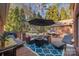 Enjoy outdoor living on this beautiful brick patio with comfortable seating, a fire pit, and dining area at 102 Wyndham Way, Salisbury, NC 28147