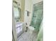 Modern bathroom with updated shower and sink with stylish patterned floor and window at 1111 Ladell Ln, Shelby, NC 28152