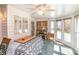 Sunroom featuring many windows, tile floors and mirrors at 1114 Setter Ln, Concord, NC 28025