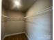 Spacious walk-in closet with wire shelving provides ample storage space at 11533 Valley Oaks Ln, Stanfield, NC 28163