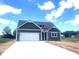Charming single-Gathering home with a two-car garage and a well-manicured lawn at 11533 Valley Oaks Ln, Stanfield, NC 28163