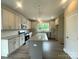 Spacious kitchen with granite countertops, an island, stainless steel appliances, and ample cabinet space at 11533 Valley Oaks Ln, Stanfield, NC 28163