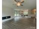 Open living space with luxury vinyl flooring, a fireplace, and an eat-in kitchen that's perfect for entertaining at 11533 Valley Oaks Ln, Stanfield, NC 28163