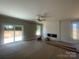 Spacious living room with fireplace and natural light at 11533 Valley Oaks Ln, Stanfield, NC 28163