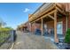 Beautiful backyard patio with covered deck above and seating at 11609 Mersington Ln, Charlotte, NC 28277