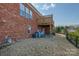 Well-maintained brick home with a manicured lawn and outdoor deck at 11609 Mersington Ln, Charlotte, NC 28277