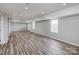 Finished basement with hardwood style floors and recessed lighting at 11609 Mersington Ln, Charlotte, NC 28277