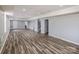 Spacious finished basement with wood-look flooring at 11609 Mersington Ln, Charlotte, NC 28277