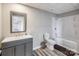 Bathroom featuring a shower over tub, sink, and toilet at 11609 Mersington Ln, Charlotte, NC 28277