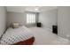 Bedroom with nightstands, a window with shutters and carpeting at 11609 Mersington Ln, Charlotte, NC 28277