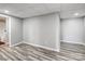 Spacious bedroom featuring modern recessed lighting and beautiful wood flooring at 11609 Mersington Ln, Charlotte, NC 28277