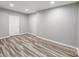 This bedroom has a clean, neutral design and contemporary wood floors at 11609 Mersington Ln, Charlotte, NC 28277