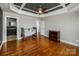 Charming bedroom with hardwood floors, trey ceiling, and a comfortable crib at 11609 Mersington Ln, Charlotte, NC 28277