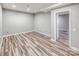 Bedroom featuring neutral walls, modern flooring, and plenty of natural light at 11609 Mersington Ln, Charlotte, NC 28277