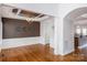Dining room with hardwood floors, wainscoting, and a chandelier at 11609 Mersington Ln, Charlotte, NC 28277