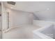 Open loft space with neutral walls, carpet flooring, and ample natural light at 11609 Mersington Ln, Charlotte, NC 28277