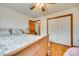 Bedroom with hardwood floors, ceiling fan, closet, and doorway leading to another room at 1221 Edgefield Rd, York, SC 29745