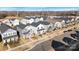 Aerial view showcasing neighborhood homes, sidewalks, and street parking at 12425 Larue Ln, Huntersville, NC 28078